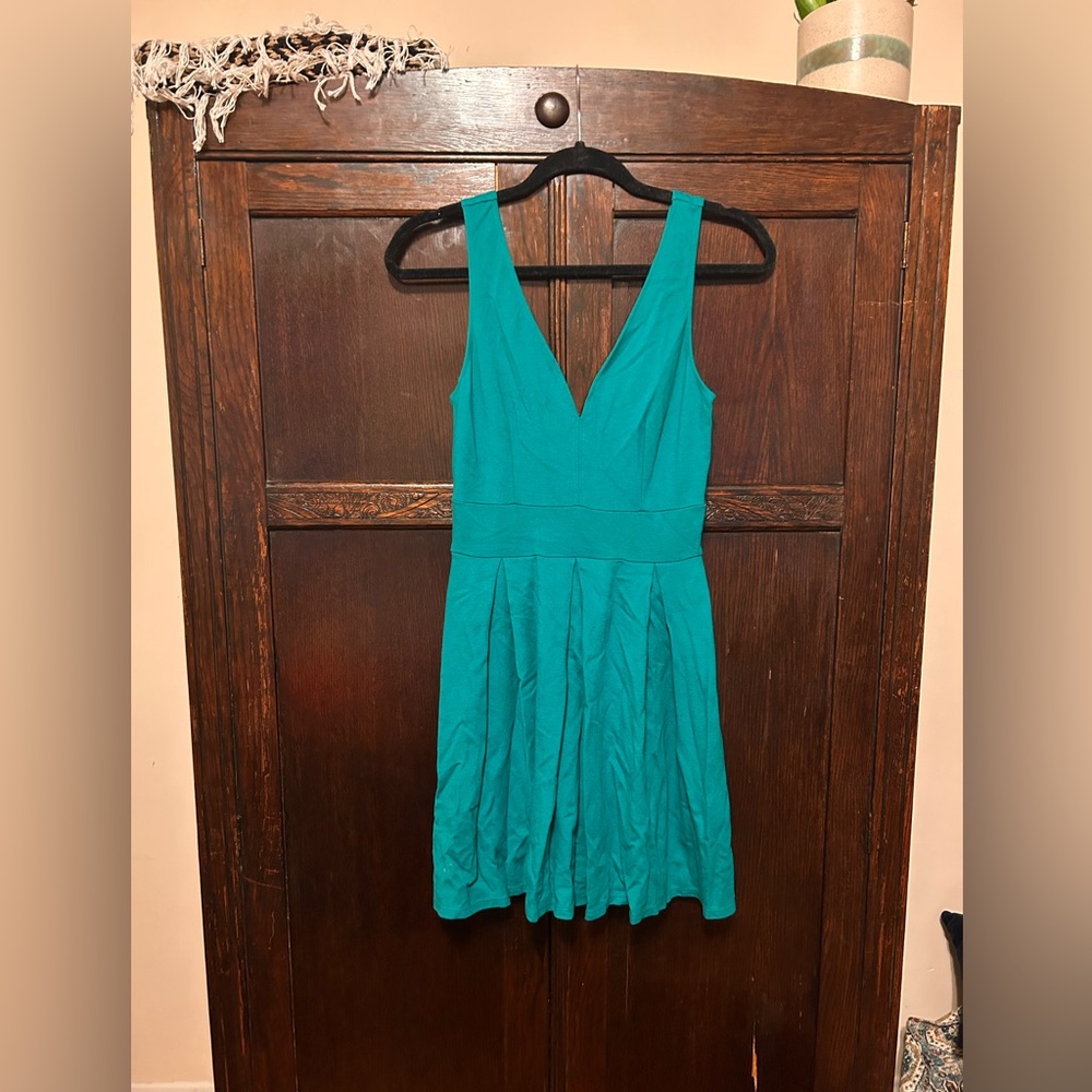 Very flattering blue/green dress. Size small, worn only a handful of times.